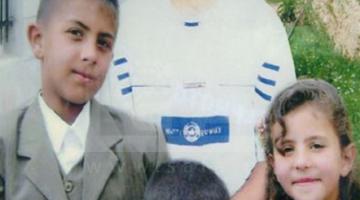 أسير يكسر جدران الاعتقال للتواصل مع أبنائه